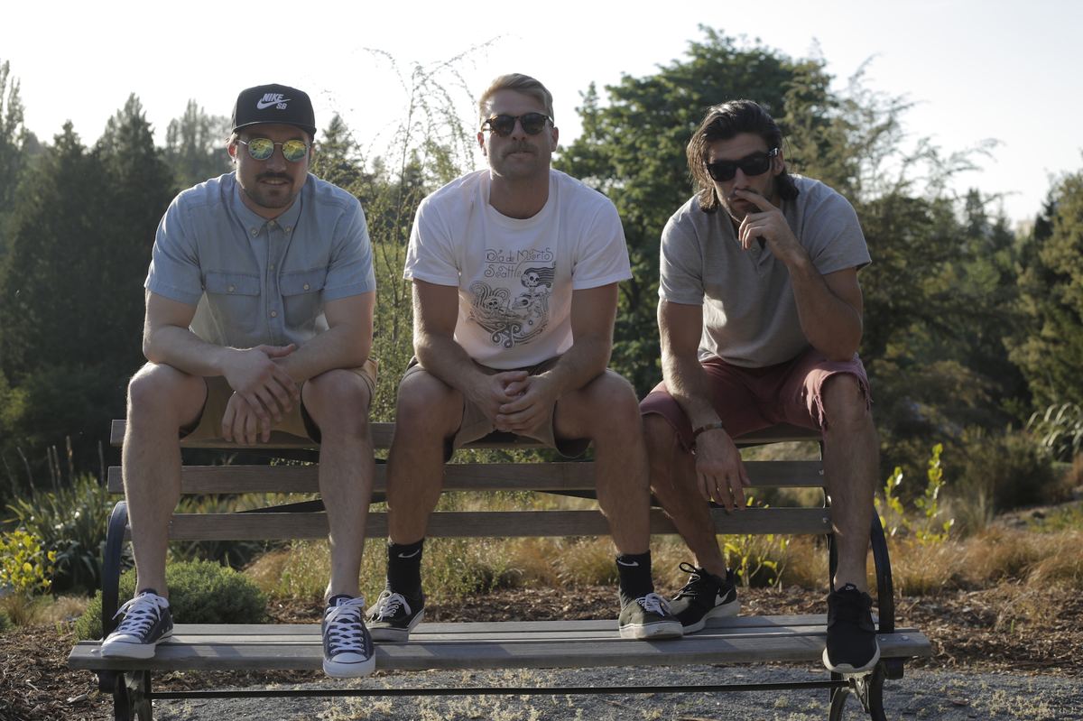 The Good Husbands on a bench